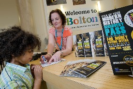 Photograph of Child getting his Modern History Discovery Pass stamped at Bolton Museum 
